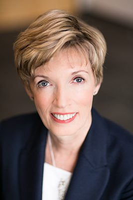 Kathy Kinloch smiling at the camera.