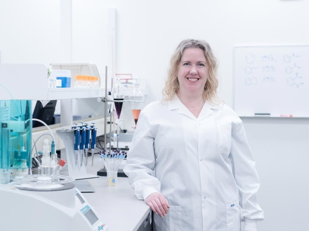 Woman standing in chemistry lab