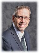 Photo of Wayne Hand over a grey background