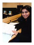 Photo of a student looking in a book.