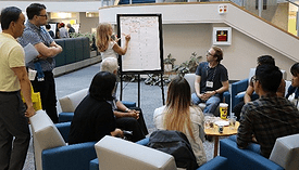 Photo of students attending a recycling workshop.