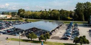 solar panels covering cars in parking lot