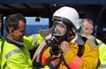 firefighters with safety gear on.