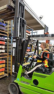 Forklift operator in action.