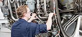 technician working on airplane wiring.