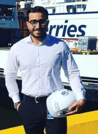 Mehran Zargham holding hard hat.