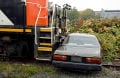 Car crash beside a train car.
