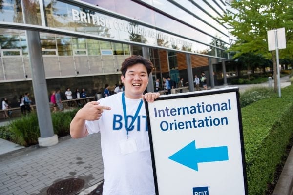 Smiling student volunteer at BCIT International Orientation