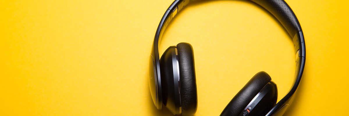 Headphones on yellow background.