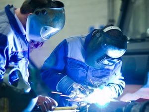 two people welding