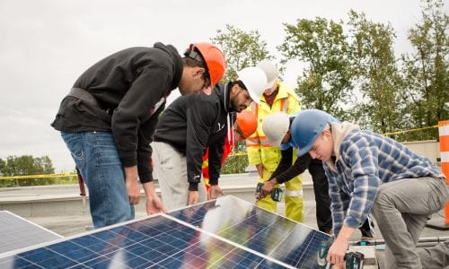 students working on solar panels