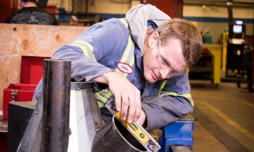 Student working on a metal fabrication project