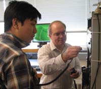 instructor showing a student an electrical panel