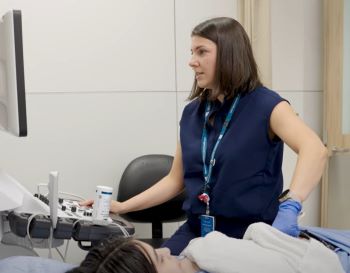 Sonography Grad working with  patient doing abdominal ultrasound
