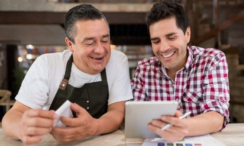 Men doing the books at a restaurant