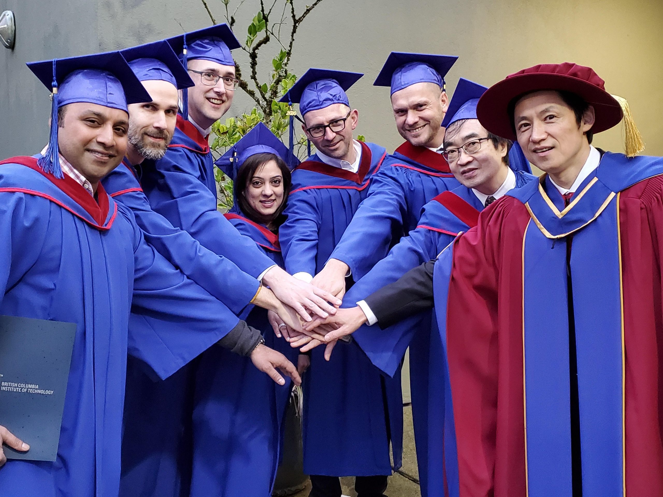 TMGT graduates with instructor, Chang Han, pictured far right, at the February 2020 Convocation ceremony