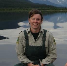 Kim Ives with a lake as the background