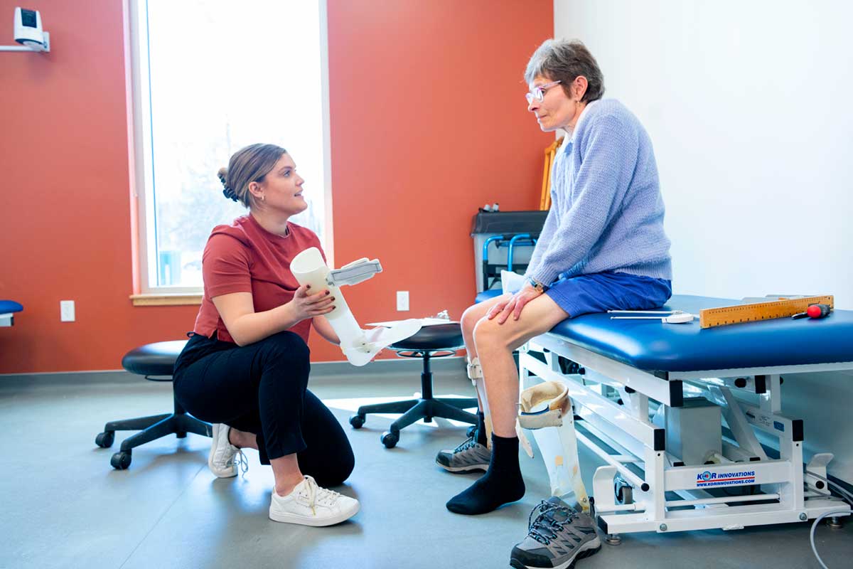 BCIT prosthetics and orthotics student assisting a patient