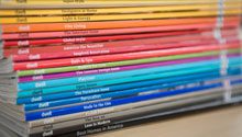 coloured magazines stacked