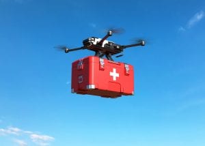 Drone with first aid kit on blue sky