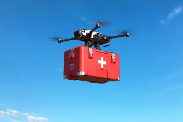 Drone with first aid kit on blue sky