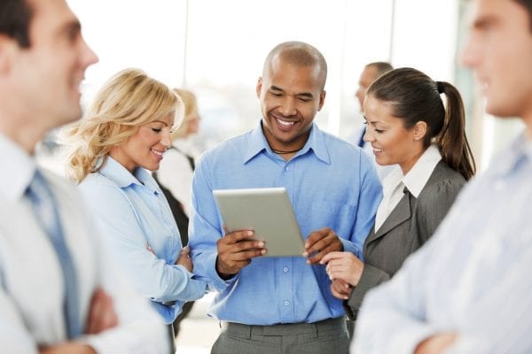 Business Team Looking at a Tablet Computer.