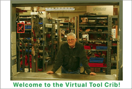 Photo of man standing at the counter of a shop with rows of shelves filled with tools