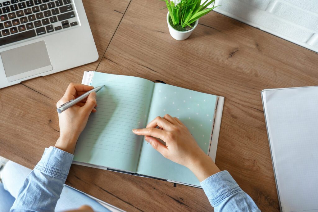 Person writing in a notebook