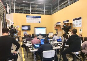 A man teaching in front of a group