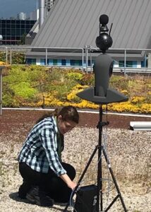 a female next to an equipment