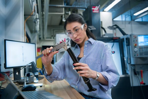 A Mechanical engineer wears safety goggles