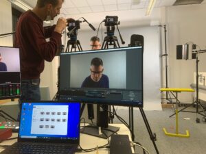 People setting up to record presentation