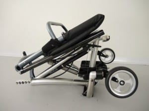 Prototype wheelchair with the wheels removed and the frame fully folded.