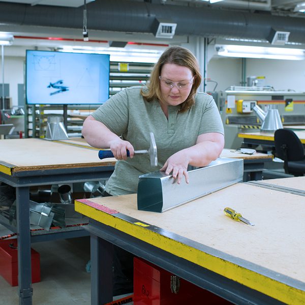 Sheet metal student in workshop