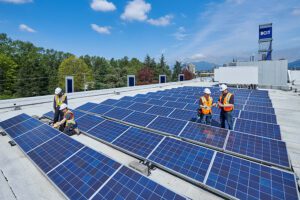 BCIT students working on solar panels on the rooftop of the Gateway Building.