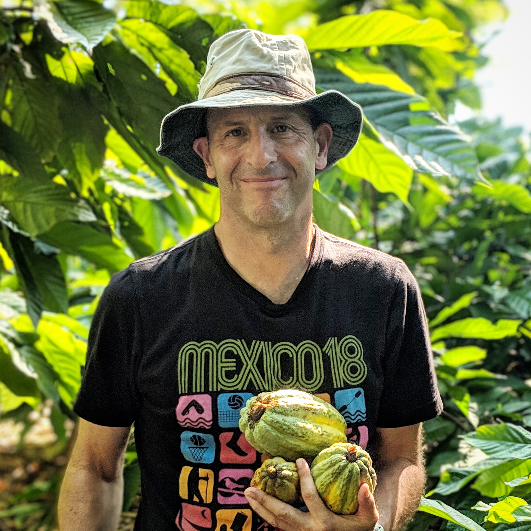 David Leventhal, a male in black tshirt, bucket hat, and fruits in his hand