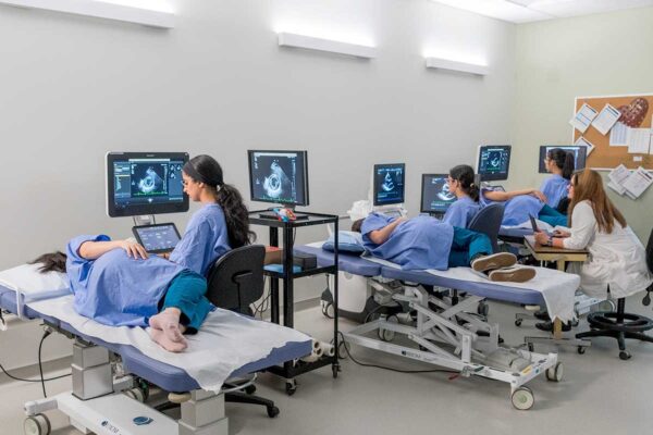 BCIT Diagnostic Medical Sonography students with instructor in lab