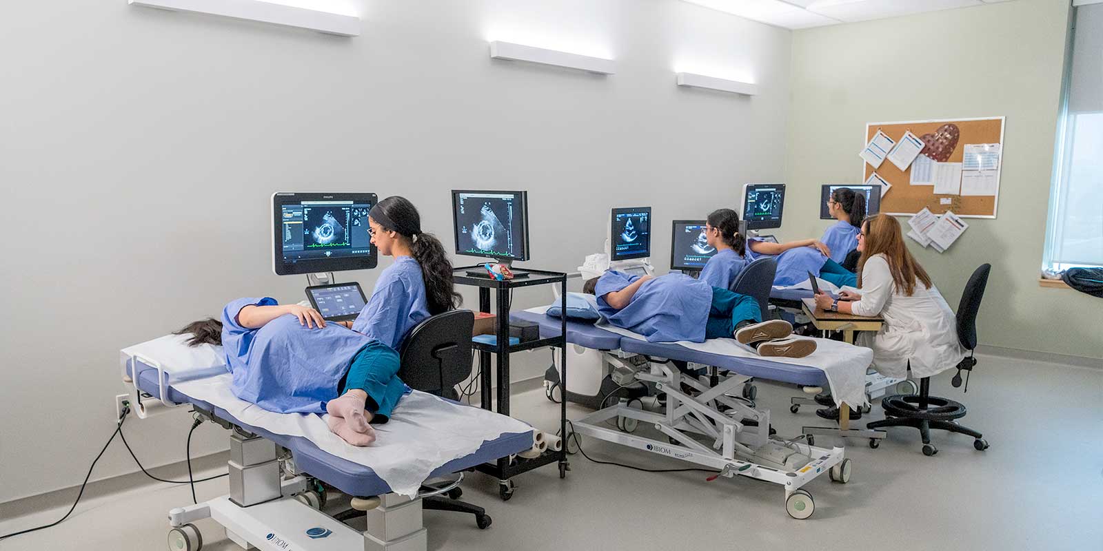 BCIT Diagnostic Medical Sonography students with instructor in lab