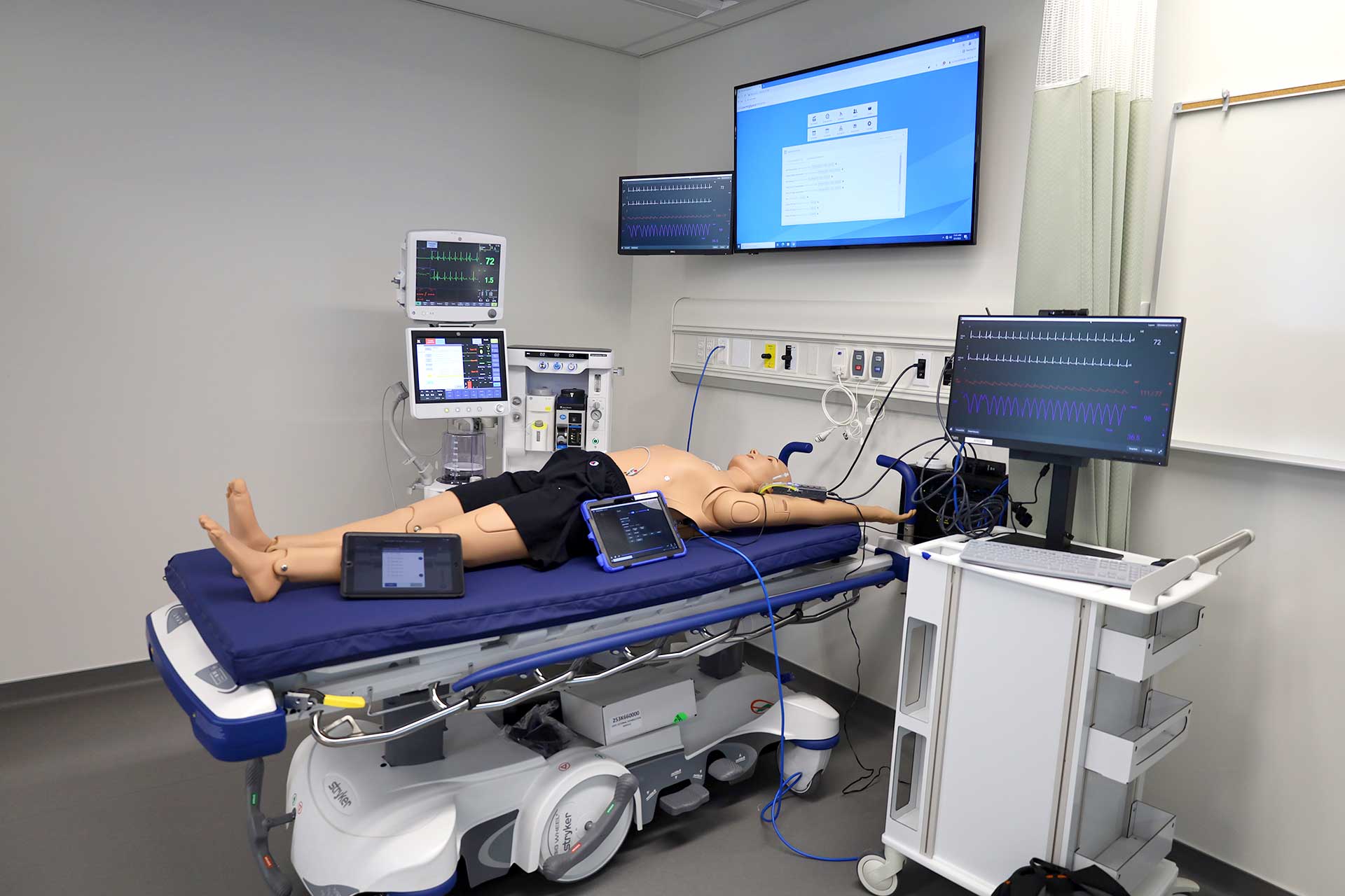 simulation manikin in hospital bed