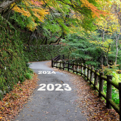 New year 2023 to 2024 on walkway in the mountain with maple trees.