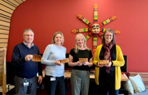 APQA staff with weaved baskets