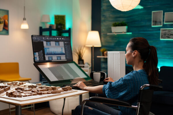 Professional woman architect working on building plan using modern technology equipment touchpad monitor screen computer.
