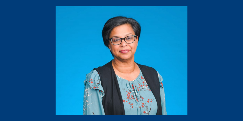 Nitasha Naiker, Program Head, BCIT Accounting and Finance Diplomas headshot on a blue background.