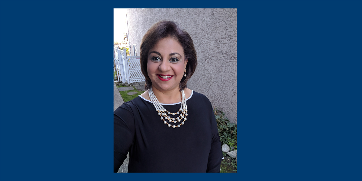 Rosmin Gilani in black blouse and silver necklaces.