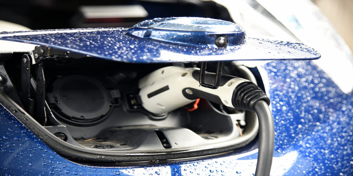Electric vehicle charging at an EV charging station.