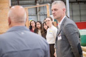 Josh St Cyr, Project Director, Kiewit standing next to BCIT students, and staff, and faculty.