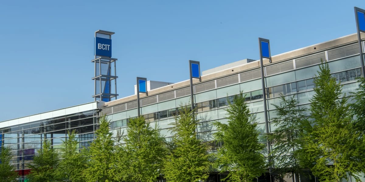 A photo of a building at the BCIT Burnaby Campus. The blue BCIT logo is in view.
