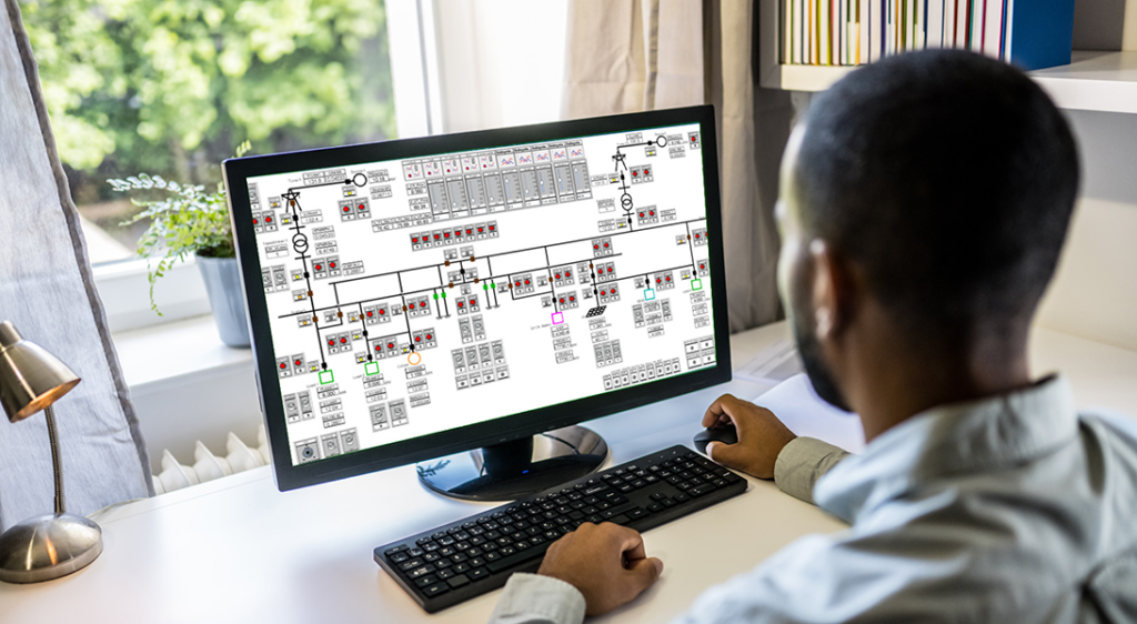 man sitting in front of computer screen
