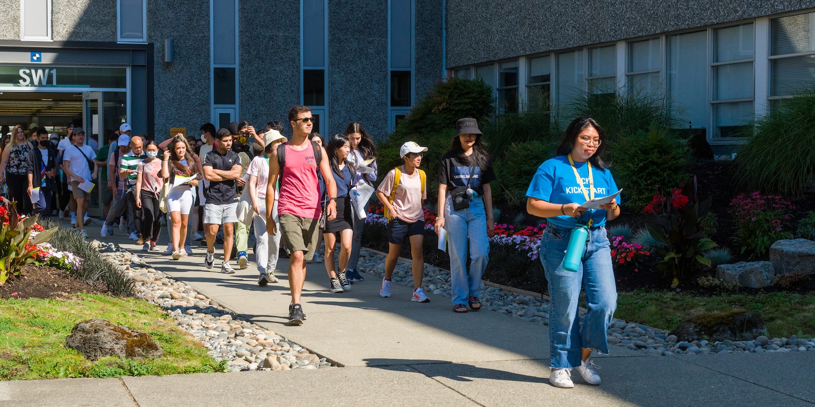 A campus tour guide leads new students on a tour of the BCIT Burnaby Campus during the Kick Start campus orientation.