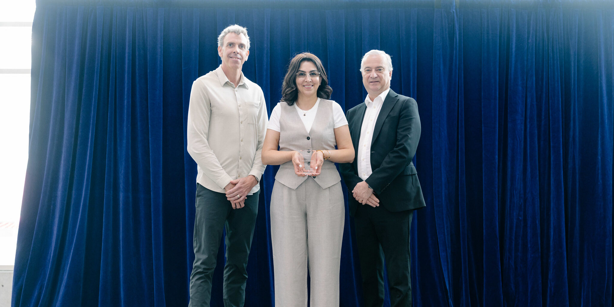 Minoo Shariat-Zadeh receiving the 2025 Employee Excellence Award